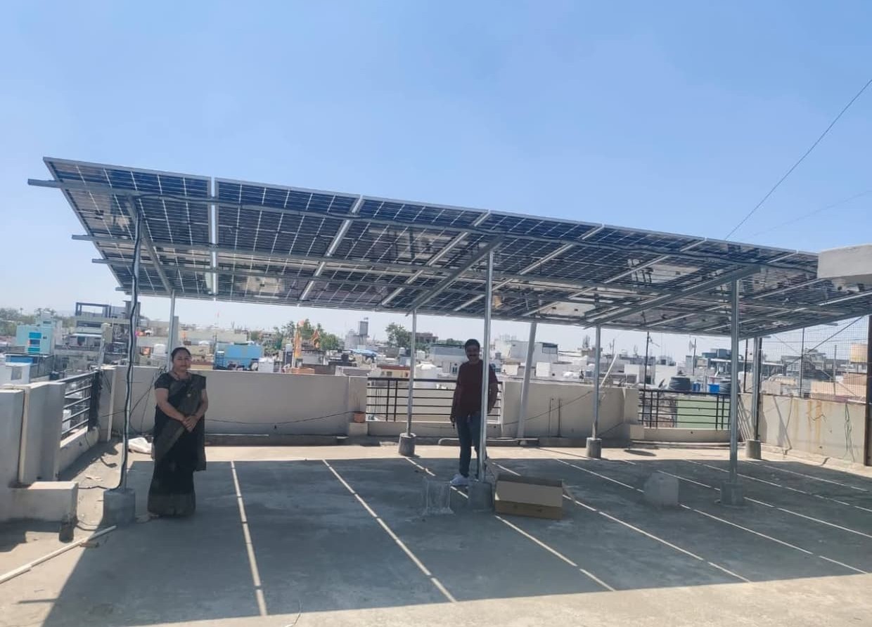 Elevated rooftop solar canopy with happy family in Seoni
